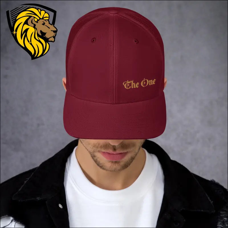 Burgundy trucker cap with gold The One embroidery for a bold look