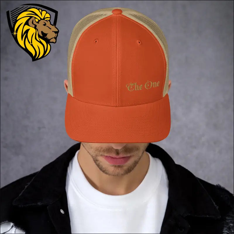 Orange and tan trucker cap with The One text for a bold look in esta gorra collection