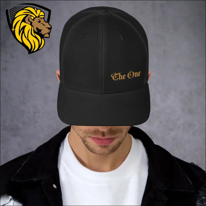 Black baseball cap with gold The One embroidery for a bold look in trucker cap style