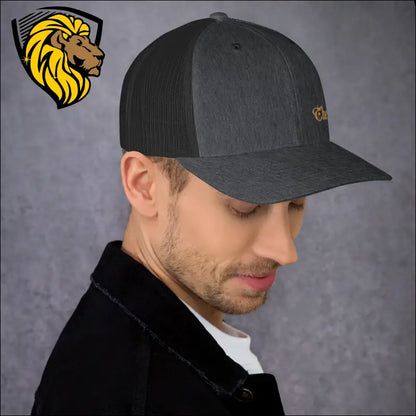 Dark gray trucker cap with mesh back and gold logo for a bold look