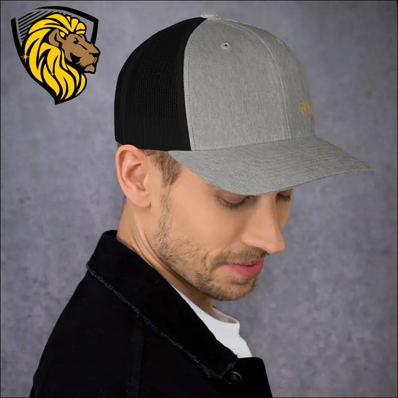 Gray and black trucker cap with curved brim featuring Gold The One embroidery design