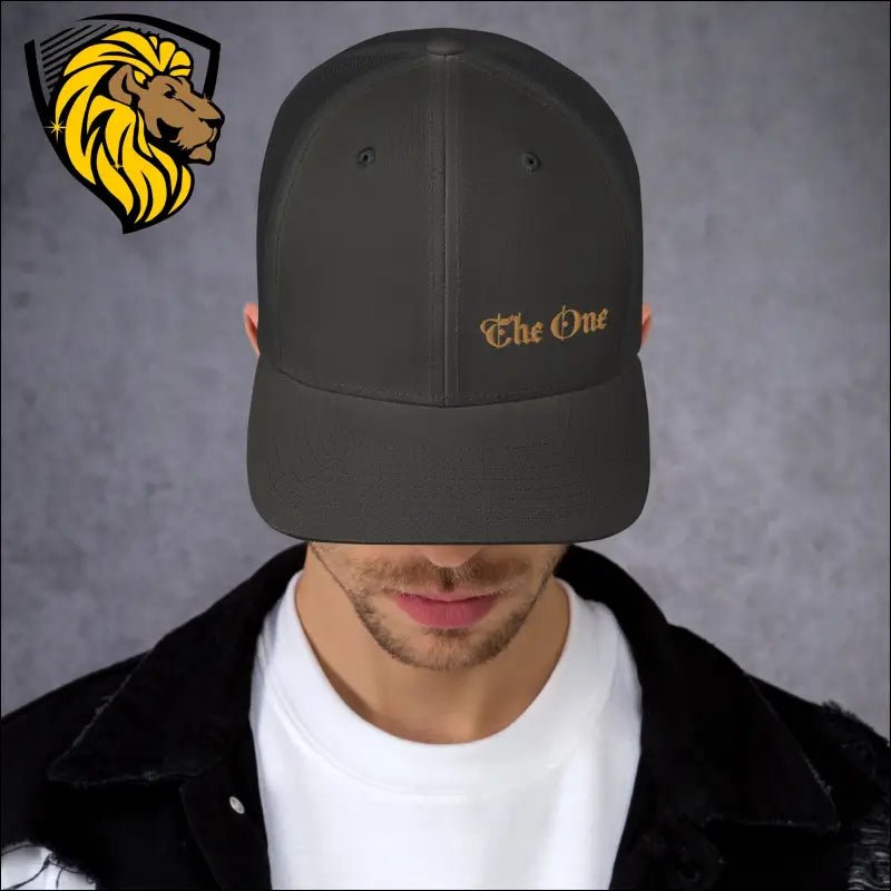 Dark gray trucker cap with gold The One embroidery for a bold look