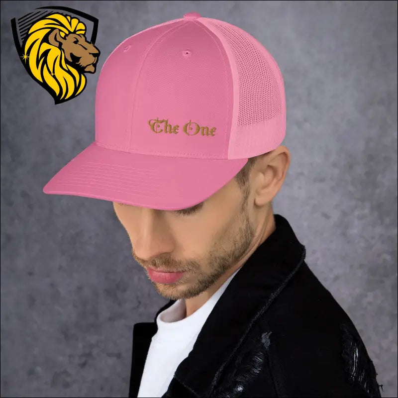 Pink trucker cap with gold The One embroidery for a bold and stylish look