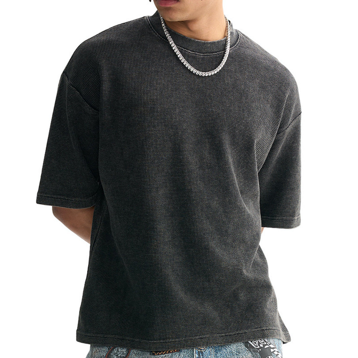 Person wearing a dark gray t-shirt on a white background