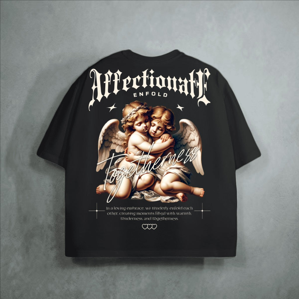 The One PR black heavyweight cropped loose t-shirt with cherubs embracing graphic and text.