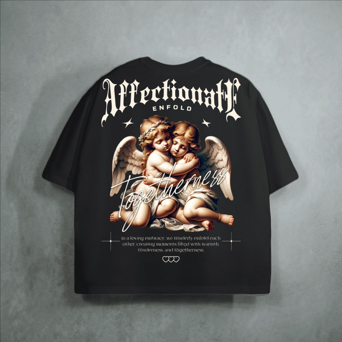 The One PR black heavyweight cropped loose t-shirt with cherubs embracing graphic and text.