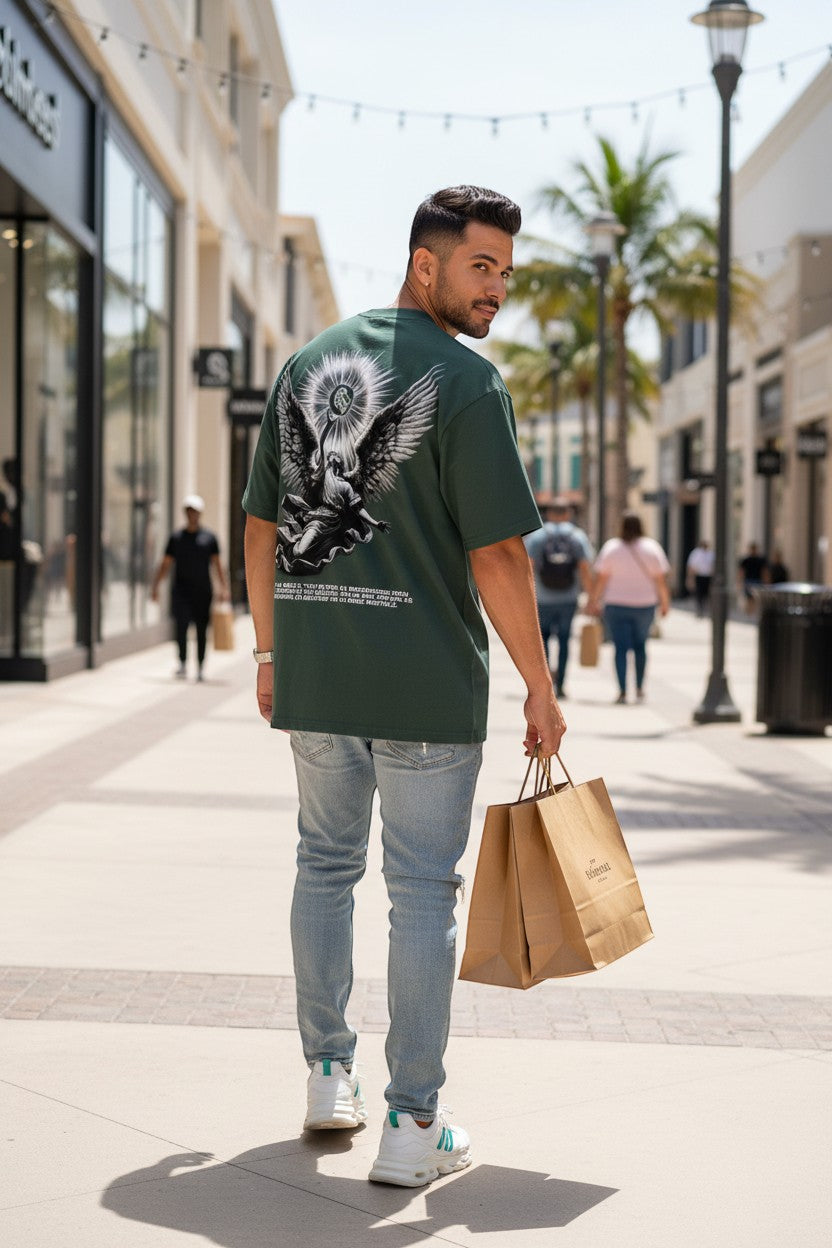 The One PR dark green heavyweight cotton boxy t-shirt with a celestial angel graphic on the back.