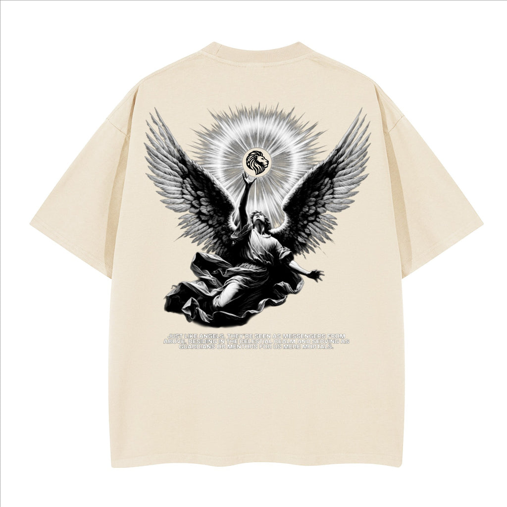 The One PR cream heavyweight cotton boxy t-shirt with angel graphic and text "JUST LIKE ANGELS, THEY'RE SEEN AS MESSENGERS FROM ABOVE, RESIDING IN THE CELESTIAL REALM AND SERVING AS GUARDIANS OR MENTORS FOR US MERE MORTALS."