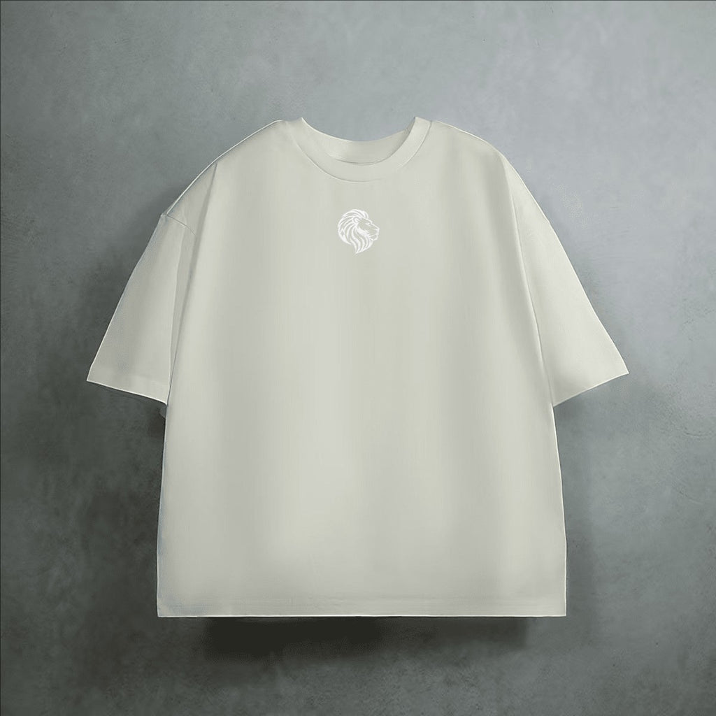 The One PR heavyweight cropped loose t-shirt in cream, made from 100% combed cotton with a subtle embroidered lion logo on the chest.