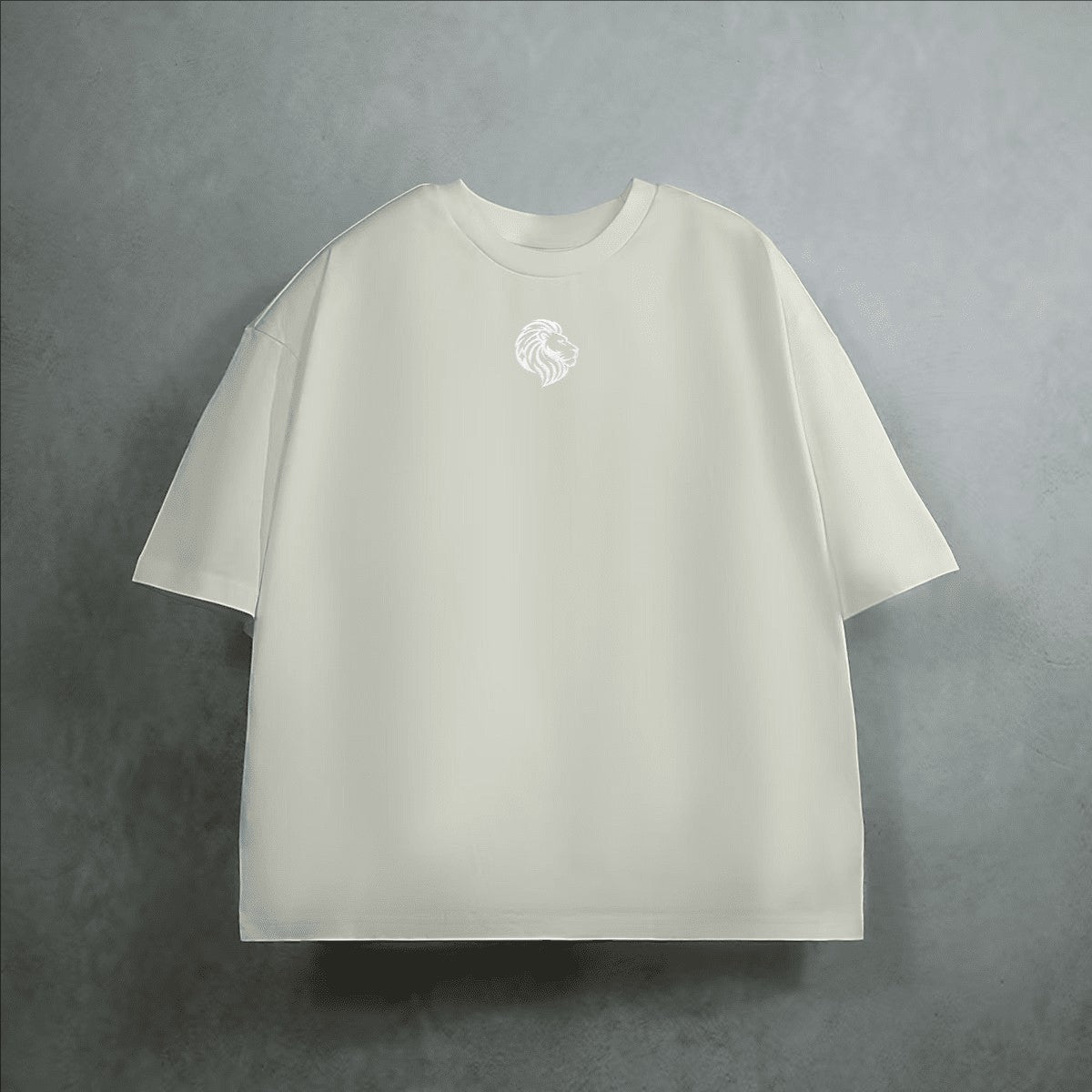 The One PR heavyweight cropped loose t-shirt in cream, made from 100% combed cotton with a subtle embroidered lion logo on the chest.