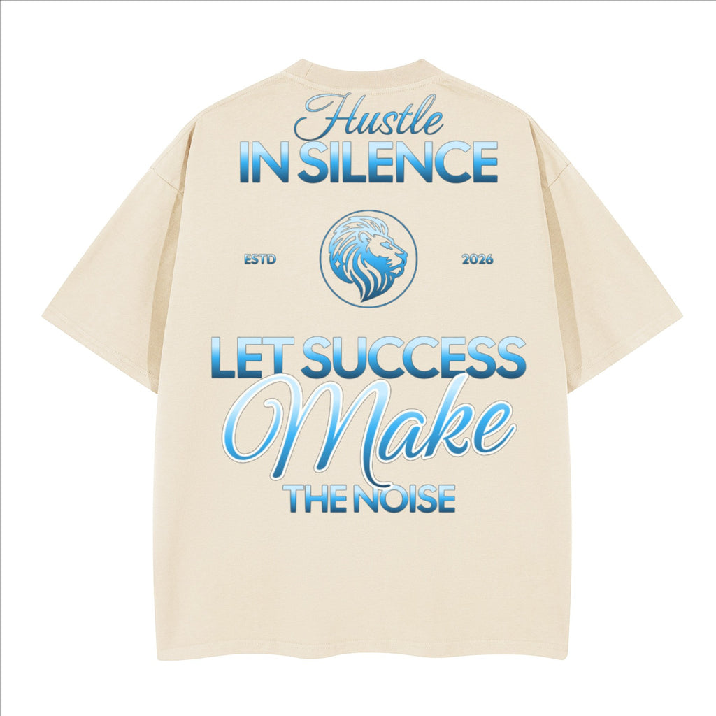 The One PR Prophesy heavyweight boxy t-shirt in cream cotton with 'Hustle IN SILENCE' and 'LET SUCCESS Make THE NOISE' graphic. Features a lion emblem.
