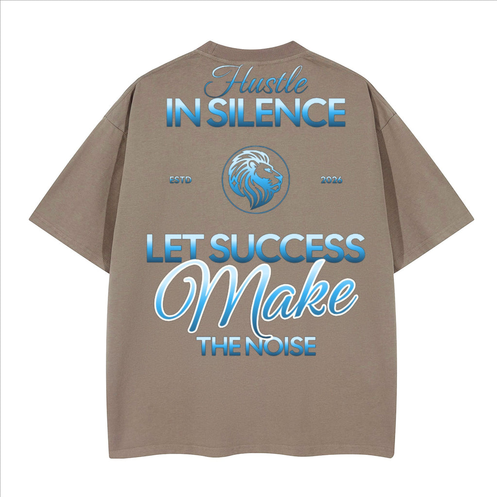 The One PR Prophesy heavyweight boxy t-shirt in taupe, featuring a crew neck, drop shoulders, and a loose fit. Back graphic with blue text and a lion emblem.