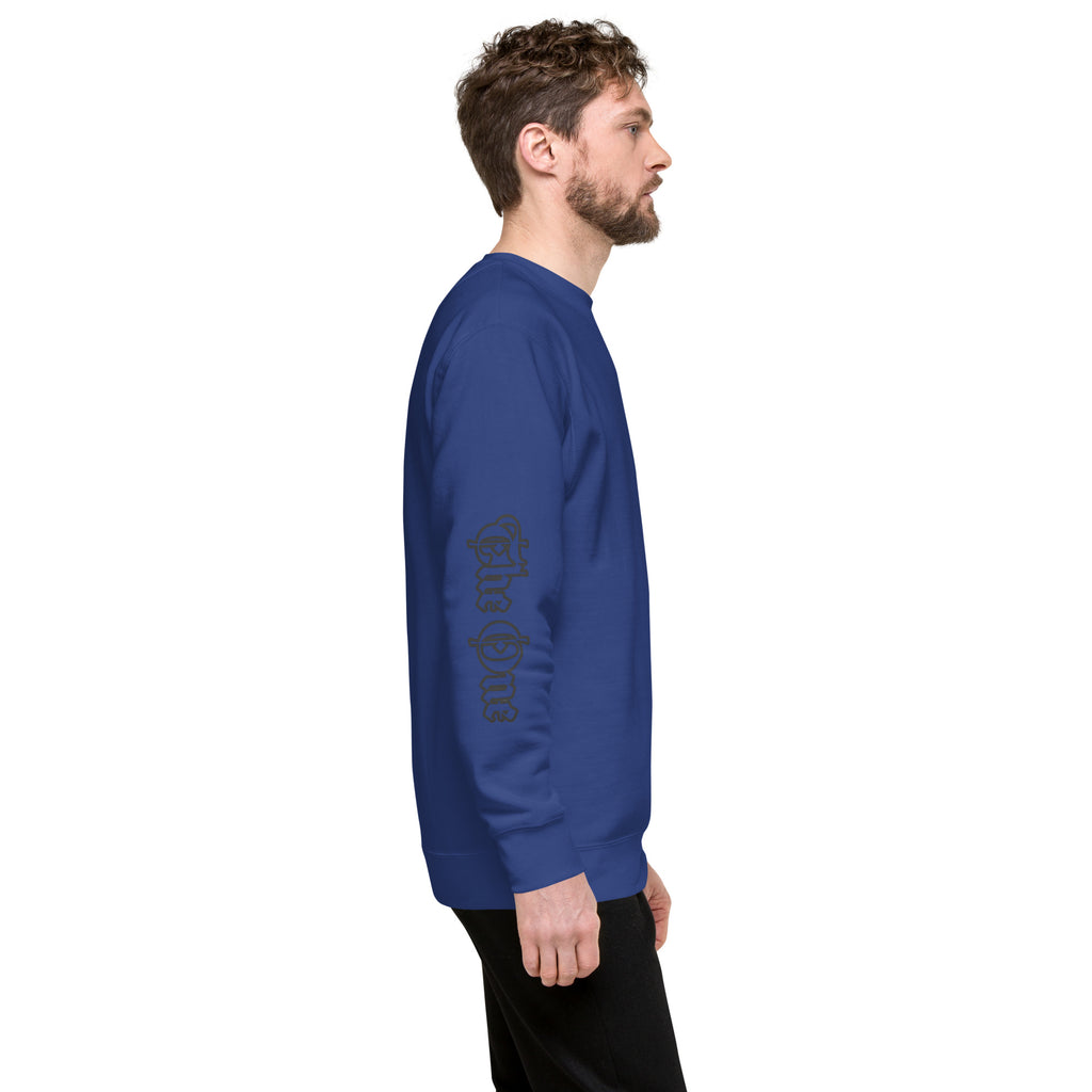 Unisex Premium Crewneck Sweatshirt by The One PR: Classic Streetwear Style. Man side view wearing blue sweater with logo on sleeve.